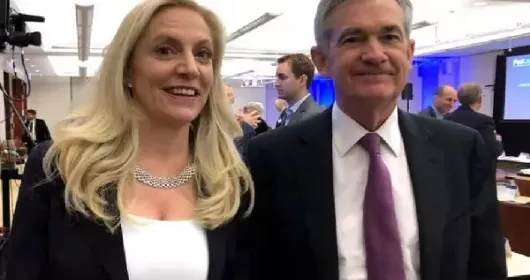 FILE PHOTO: Federal Reserve Chair Jerome Powell poses for photos with Fed Governor Lael Brainard at the Federal Reserve Bank of Chicago